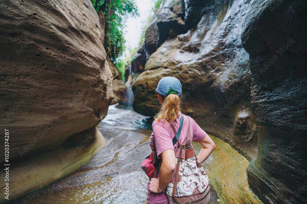 Tourist is looking at canyon in the Hells Gate National Park, Kenya