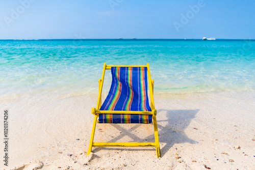 Serene Tropical Beach with Vibrant Beach Chair