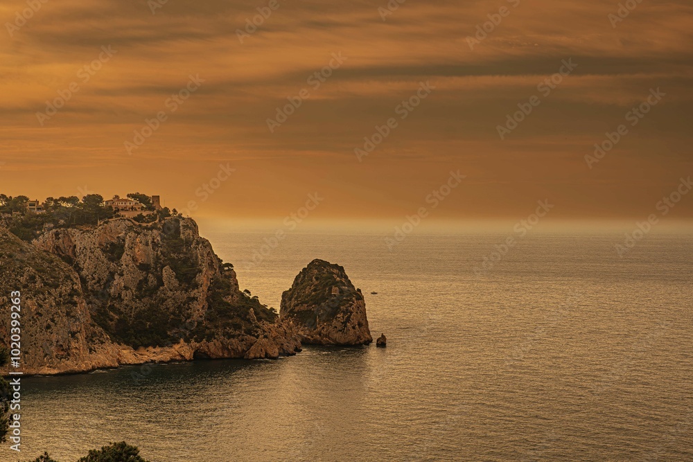 The Granadella cove with crystal-clear waters in Javea, Alicante, in the Spanish Mediterranean The Granadella cove with crystal-clear waters in Javea, Alicante, in the Spanish Mediterranean