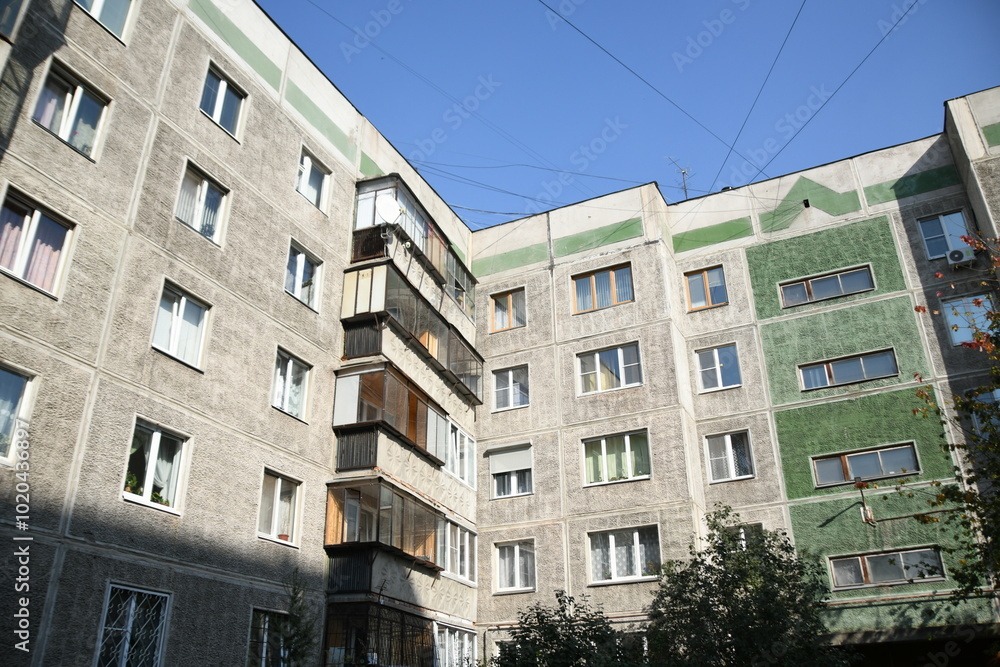 Cityscape of Russia. Panel house of the Soviet Union, old architecture of the building in the brutalism style Cityscape of Russia. Panel house of the Soviet Union, old architecture of the building in the brutalism style