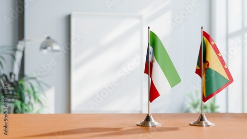 FLAGS OF EQUATORIAL GUINEA AND GRENADA ON TABLE