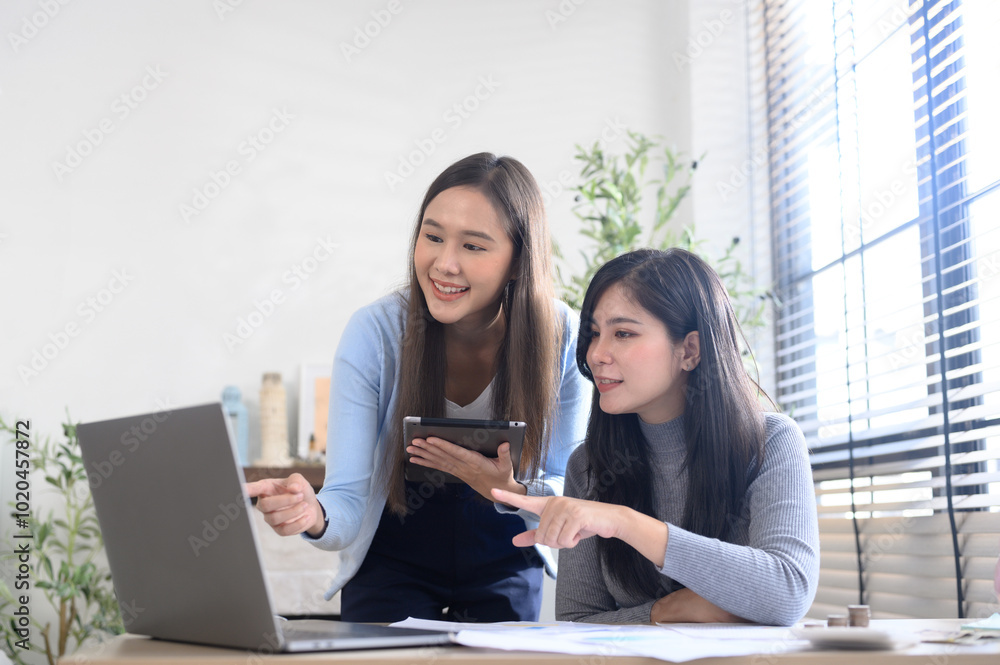 Business women are calculating income-expenditure and analyzing real estate investment data at office, Accounting Financial and tax systems concept. Business women are calculating income-expenditure and analyzing real estate investment data at office, Accounting Financial and tax systems concept.