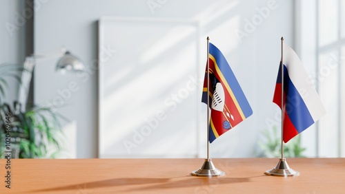 FLAGS OF ESWATINI AND RUSSIA ON TABLE