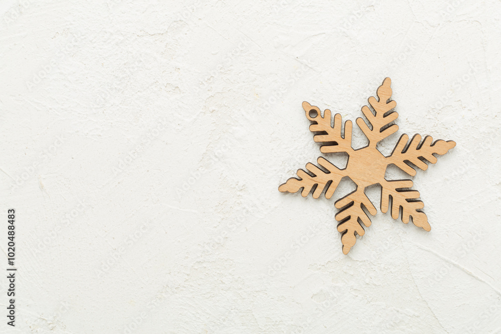 Beautiful snowflake on concrete background, top view Beautiful snowflake on concrete background, top view