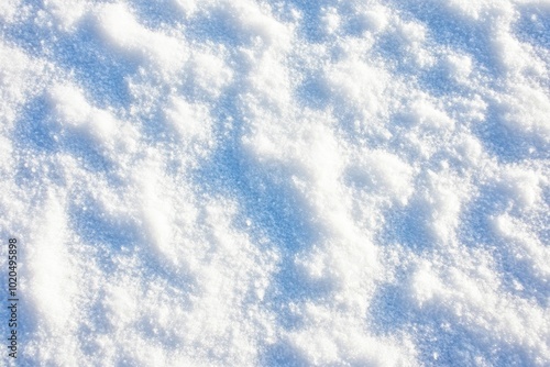 A white snow background texture with frozen snowflakes and snow lumps. A winter background with frozen snowflakes. A winter landscape with details. Cold weather.