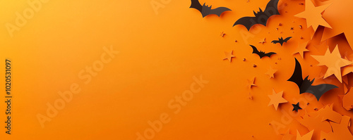 Halloween banner with bats and stars on an orange background.Minimal creative holiday concept.Copy space,flat lay