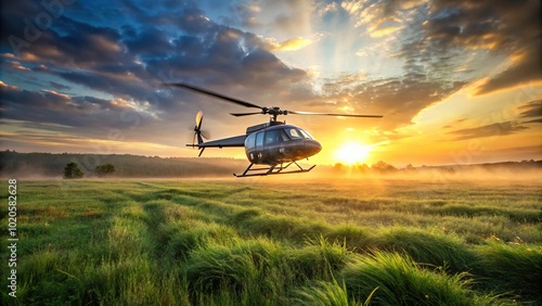 Forced perspective helicopter taking off at sunrise from grassy field photo