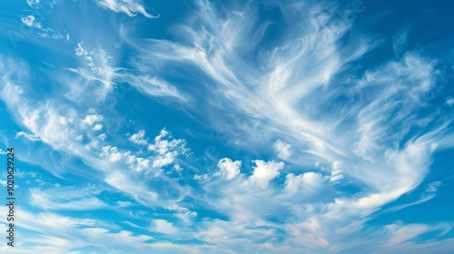 Fototapeta Naklejka Na Ścianę i Meble -  High altitude cirrus clouds swirling in clear blue sky