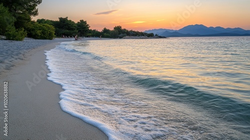 Wallpaper Mural Sandy Beach with Foamy Waves and Mountain Range at Sunset Torontodigital.ca