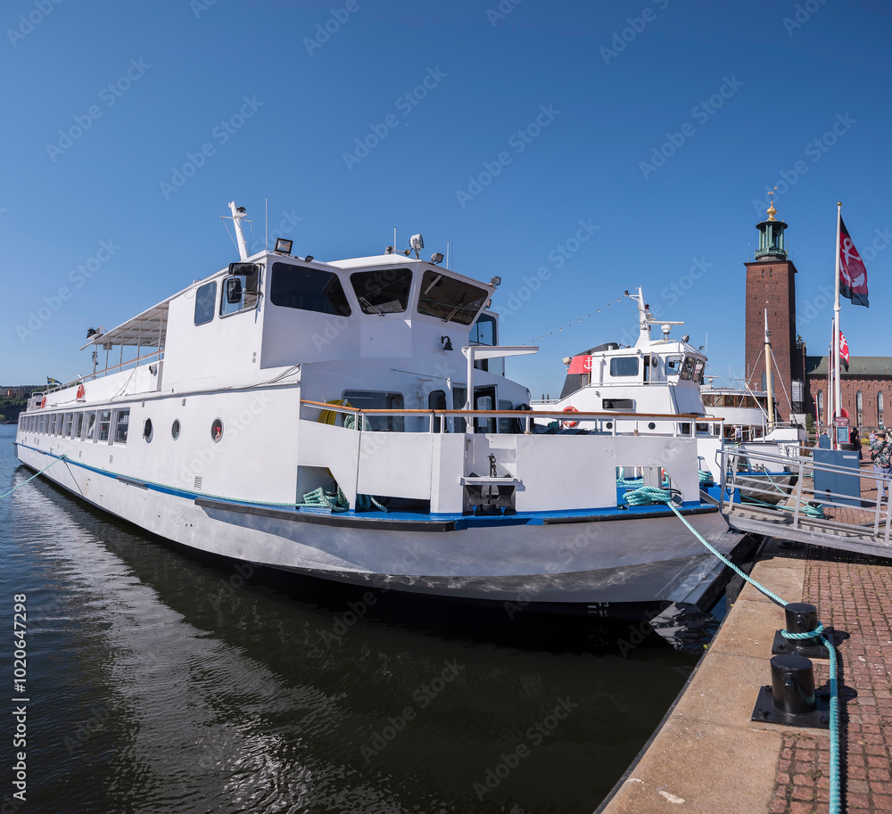 The Town City Hall with old steam commuting boats a sunny autumn day in Stockholm The Town City Hall with old steam commuting boats a sunny autumn day in Stockholm