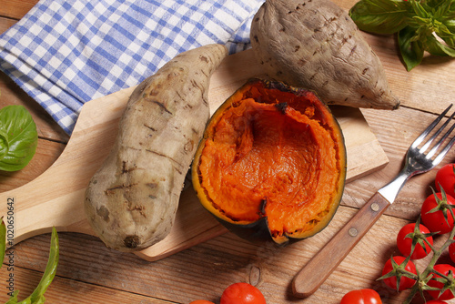 Fruits of the Earth. Sweet potatoes and a slice of pumpkin cooked in the oven and photographed from above.