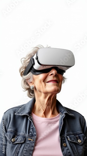 Elderly woman engaged in Virtual Reality Experience isolated on a white background.