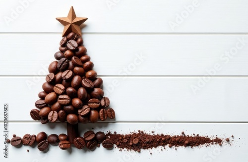 Coffee beans in the form of a Christmas tree with a star lie on a white wooden surface photo