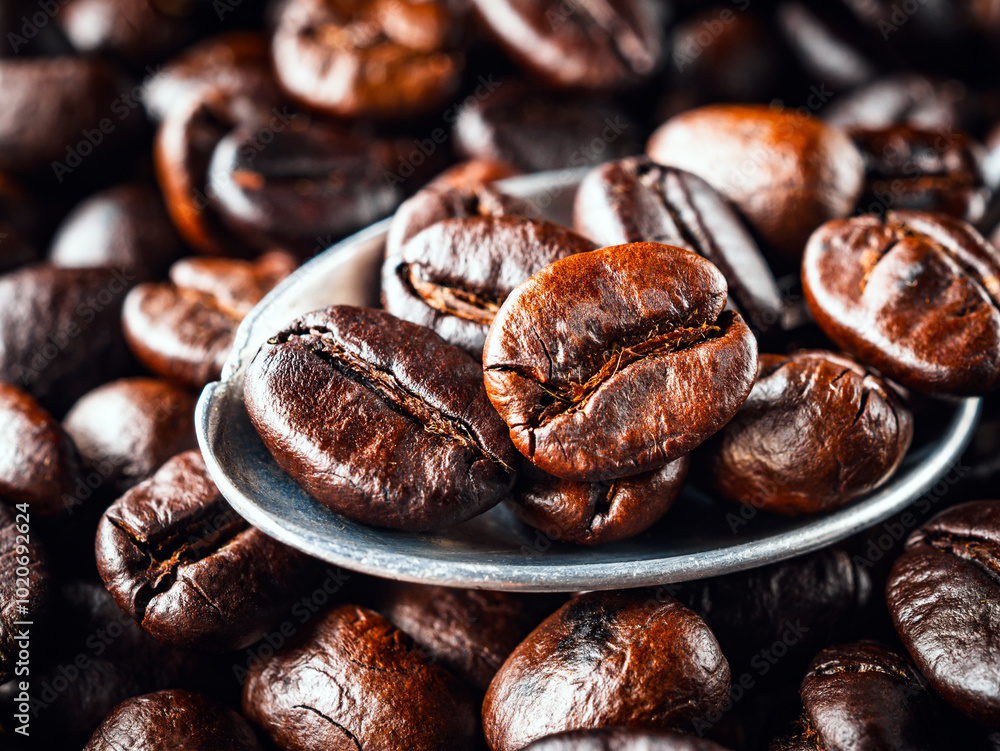 Roasted coffee bean on a stainless steel spoon, Close-up of fresh roasted coffee bean, Wallpapers of roasted coffee bean, macro Roasted coffee bean on a stainless steel spoon, Close-up of fresh roasted coffee bean, Wallpapers of roasted coffee bean, macro