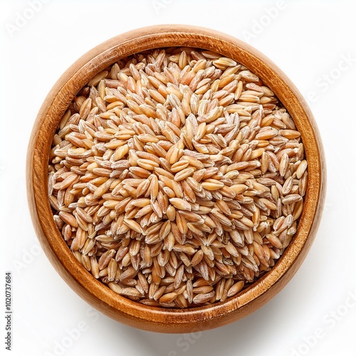 khorasan wheat or kamut triticum turgidum in wooden bowl isolated on white background