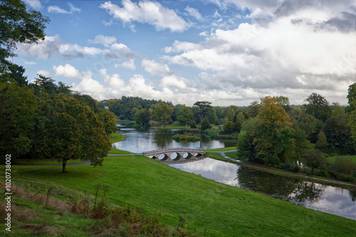 The Five Arch Palladian Bridge over the serpentine lake at Painshill Park in Cobham Surrey UK photo