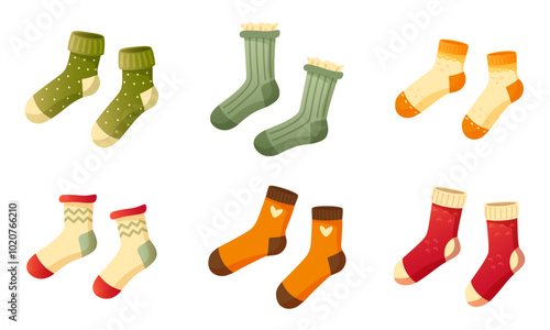 Set of stylish cotton and wool socks with different texture, color, pattern and type. Two pairs of identical socks on a white background. Warm wool socks with cute patterns. Autumn and winter socks.
