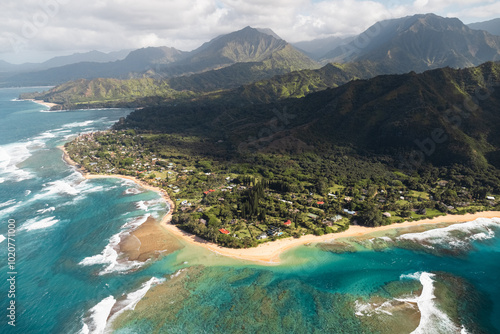 View of Kalalau Trailhead, Haena State Park and Tunnels Beach at the Na Pali Coast on Kauai during a helicopter tour (Hawaii, USA) photo