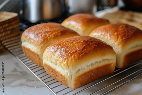 Fresh homemade bread cools on a grate. Fresh baked goods.