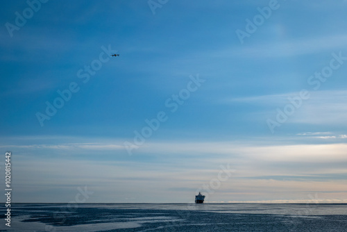 A Ship Sails the Ocean in Winter photo