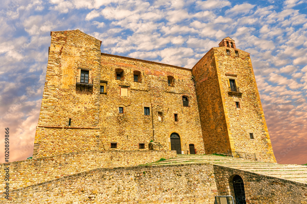 wonderful view at ancient medieval old castle or fortress in traditional Norman style with antuqoe walls and towers with beautiful blue cloudy sky on background of landscape wonderful view at ancient medieval old castle or fortress in traditional Norman style with antuqoe walls and towers with beautiful blue cloudy sky on background of landscape