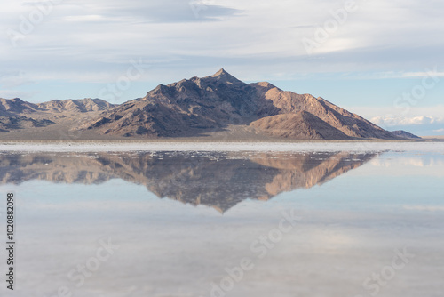 Reflection of mountains and the sky on the Bonneville Salt Flats in Utah.