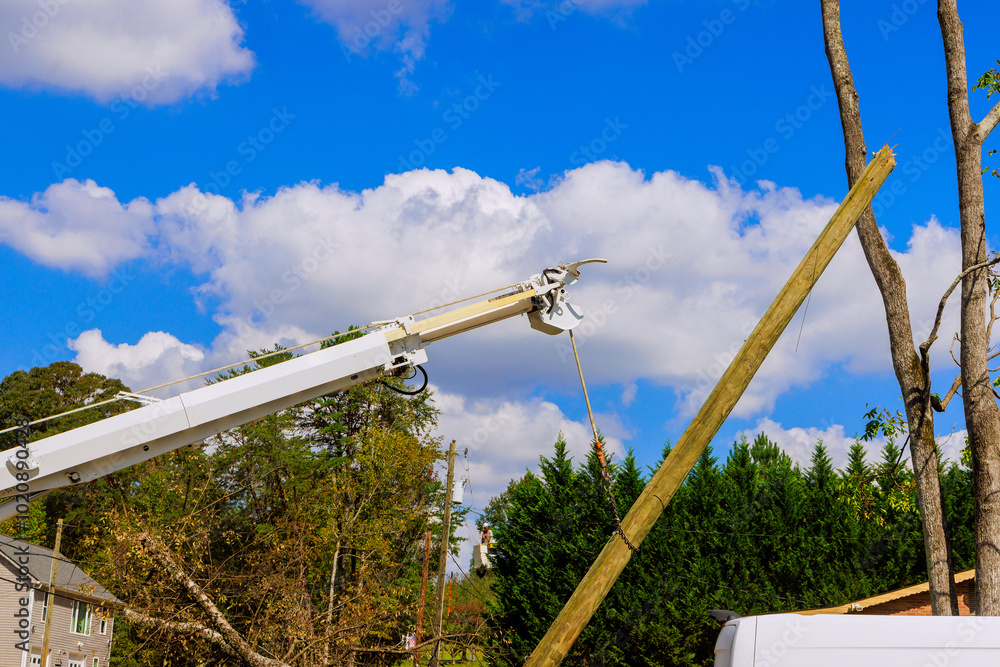 Severe hurricane has damaged electric pole power lines, which are being replaced Severe hurricane has damaged electric pole power lines, which are being replaced