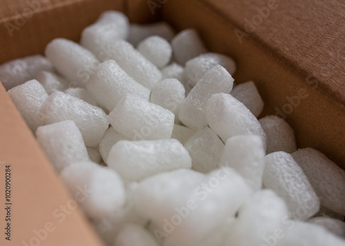 open box with packing 'peanuts' inside on the white background