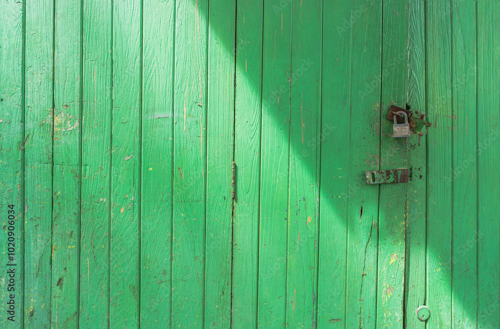 old green wooden door with light and shadow old green wooden door with light and shadow