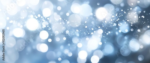 An abstract snowflake background on a blurred abstract blue background with blue bokeh.