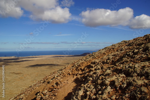 desertic landscape of volcano and caldera on the sea side