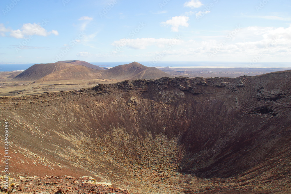 desertic landscape of volcano and caldera on the sea side desertic landscape of volcano and caldera on the sea side