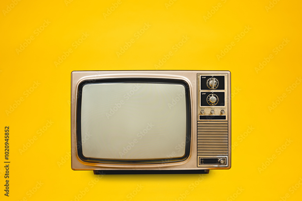 Vintage, retro old TV (television) with blank screen isolated on yellow background, front view, clipping path
