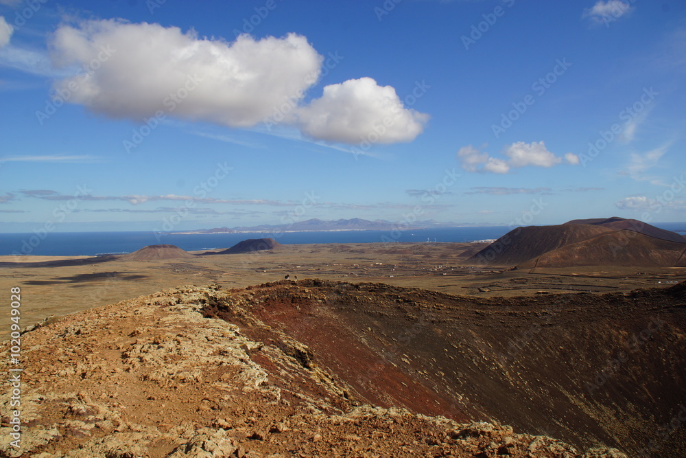 desertic landscape of volcano and caldera on the sea side desertic landscape of volcano and caldera on the sea side