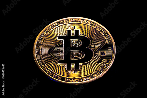 Bitcoin coin close-up on a black background. Background with cryptocurrency.