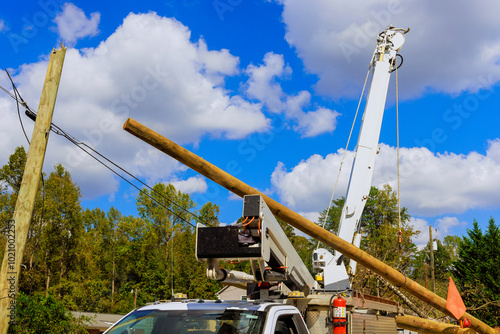 Картината върху платно In aftermath of severe hurricane, power lines have been damaged are being replac