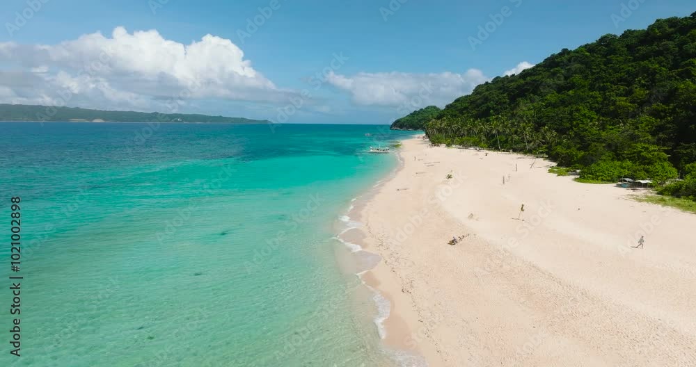 Beach with coconut trees and ocean waves on white sand. Puka Shell Beach. Boracay Island. Philippines. Beach with coconut trees and ocean waves on white sand. Puka Shell Beach. Boracay Island. Philippines.