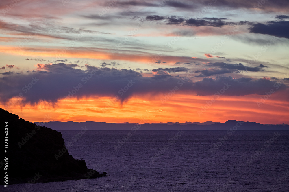 stunning sunset over Suasi Island. The sky transforms into a canvas of colors, reflecting the beauty and serenity of this magical place. Titicaca Lake Peru stunning sunset over Suasi Island. The sky transforms into a canvas of colors, reflecting the beauty and serenity of this magical place. Titicaca Lake Peru
