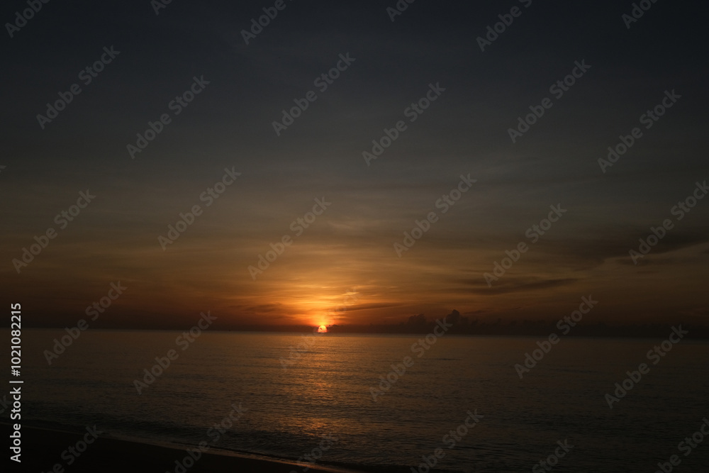 The sun rises at the sea in the morning. The sun rises at the sea in the morning.