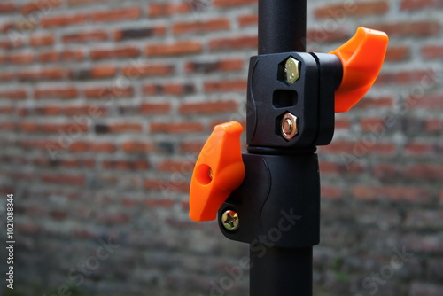 Locking on tripod. Lightstand height adjustment lock photo