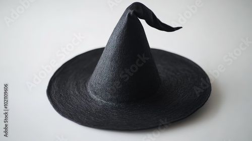 Black witch hat with a curved tip on white photo