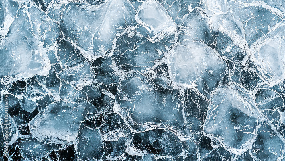 Obraz premium Capturing the beauty of frozen water, this image showcases various ice chunks with intricate patterns and textures, presenting a captivating wintry scene.
