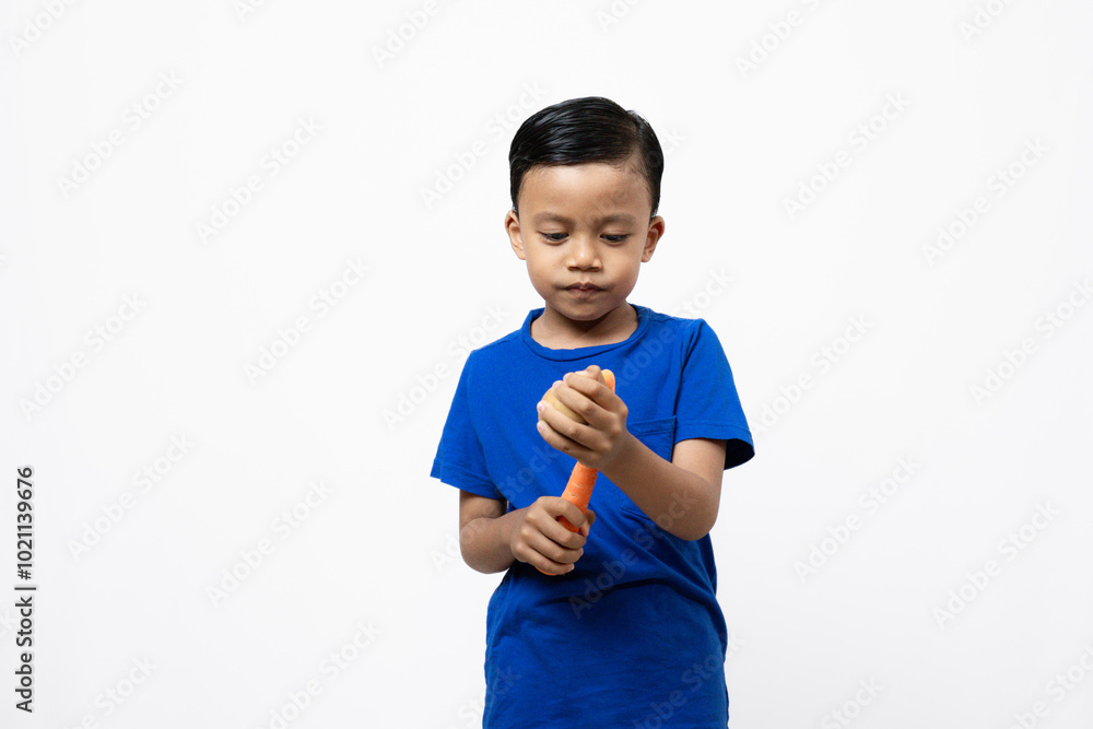 Cute and active Asian boy standing while posing with vegetables, healthy lifestyle concept, isolated white background.
Cute and active Asian boy standing while posing with vegetables, healthy lifestyle concept, isolated white background.