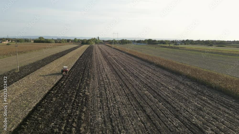 Aerial drone view of tractor farming field Aerial drone view of tractor farming field