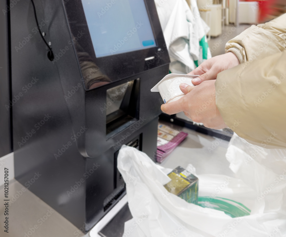Customer pays his purchase at the supermarket,self checkout systems in retail stores,Barcode scanner,Self checkout machine Customer pays his purchase at the supermarket,self checkout systems in retail stores,Barcode scanner,Self checkout machine