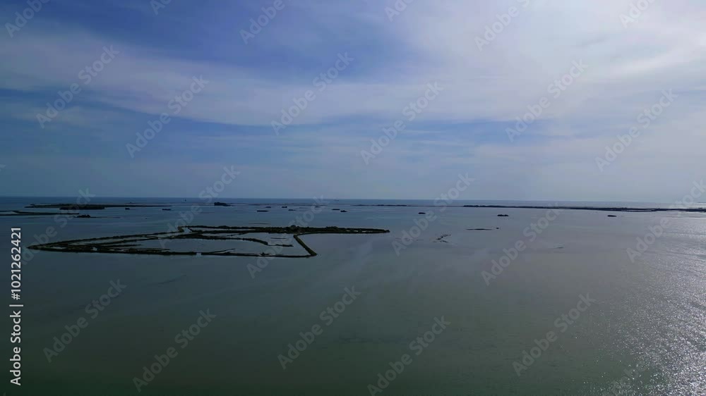 Grado Lagoon seen from above. Between waters, islands and uncontaminated nature Grado Lagoon seen from above. Between waters, islands and uncontaminated nature