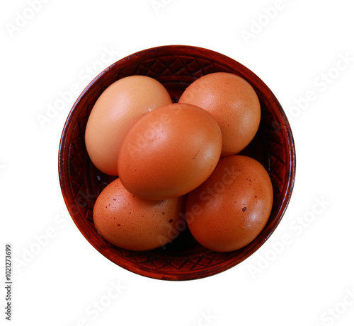 Wooden bowl with eggs isolated on white background top view photo