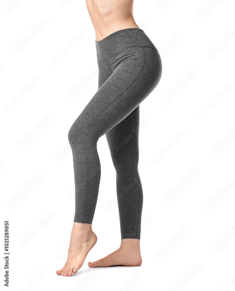 Woman wearing sports leggings on white background, closeup Woman wearing sports leggings on white background, closeup