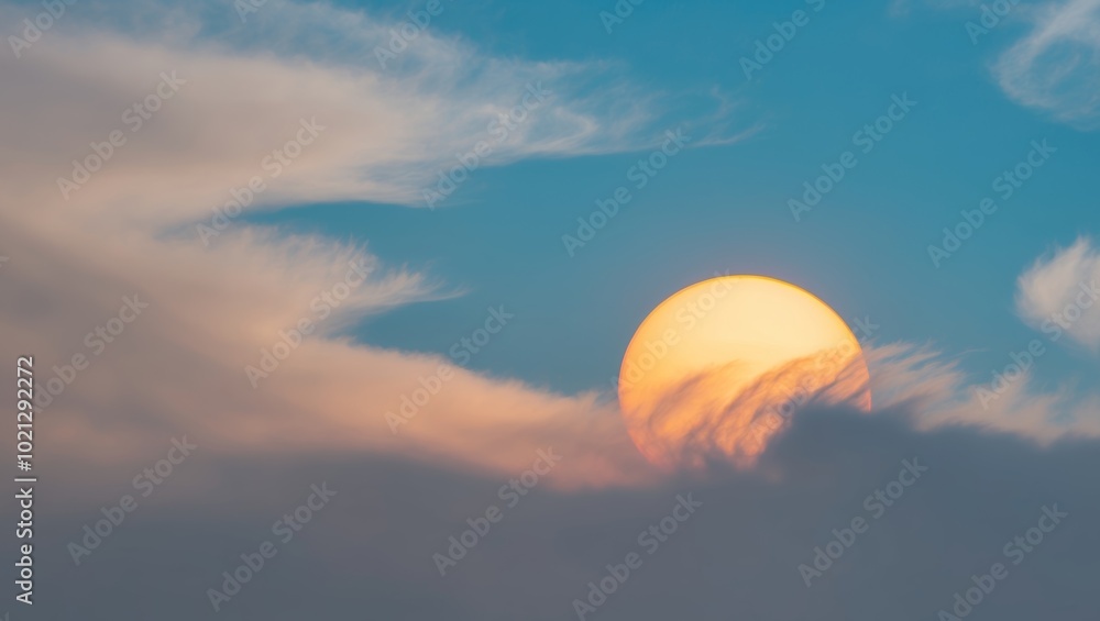 The sun shines through fluffy clouds on a clear blue sky. The sun shines through fluffy clouds on a clear blue sky.