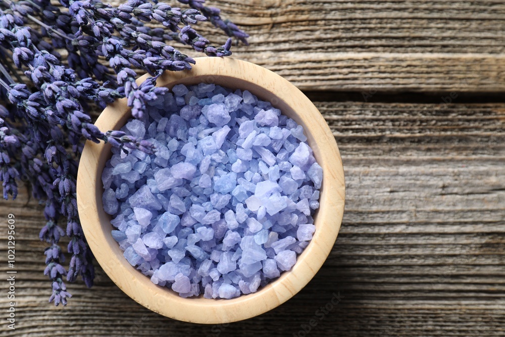 Natural sea salt and lavender on wooden table Natural sea salt and lavender on wooden table